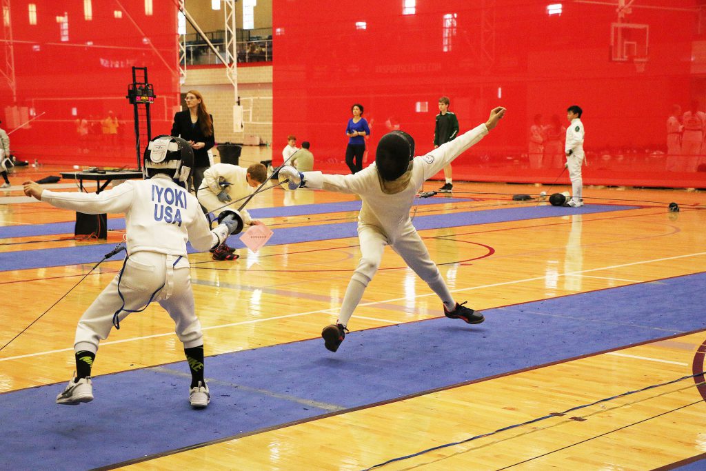 The Austin Challenge Fencing Tournament 2018 - Two fencers competing at the Round Rock Sports Center