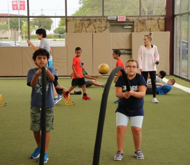 Kids doing fitness training with rope