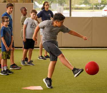 Boy kicking ball