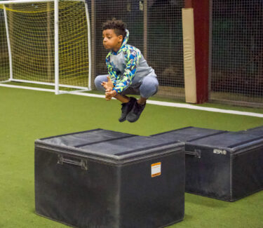 Child Athlete jumping boxes