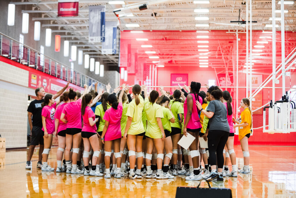 Volleyball players huddled up after a training session at the Round Rock Sports Center