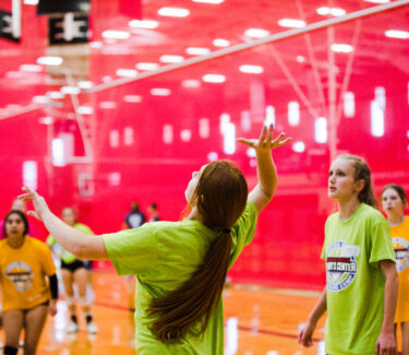A volleyball player winding up to hit a ball at a training program at the Round Rock Sports Center
